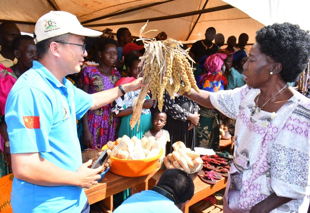 Rt. Hon. Dr. Rebecca Alitwala Kadaga showcases one of the crop that will be sowed in VAM project