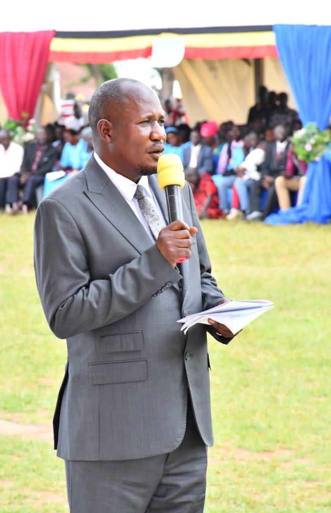 Hon. Kisa Steven, MP for Luuka South and Chairman of the Organizing Committee giving His Remarks at luuka grounds during the Regional Prayers.