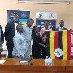 Mayor of Jinja City His Worship Alton Peter Kasolo Okocha on the left officially flagging off a 10-member delegation led by DG Busoga Consortium Mula Anthony for a two-week intensive training at China Agricultural University in Beijing