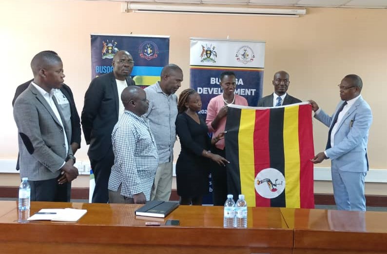 Mayor of Jinja City His Worship Alton Peter Kasolo Okocha on the left officially flagging off a 10-member delegation led by  DG  Busoga Consortium Mula Anthony for a two-week intensive training at China Agricultural University in Beijing