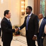 Kyabazinga of Busoga Kingdom His Majetsy William Gabula Nadiope IV shakes hands with Mr. Hao Peng(R) the party Secretary of Liaoning Provincial people's Congress.