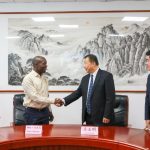 Mr Anthony Mula shakes hands with Mr Lyu Yiming, the Vice president of Shenyang Polytechnic College during the signing of the cooperation.