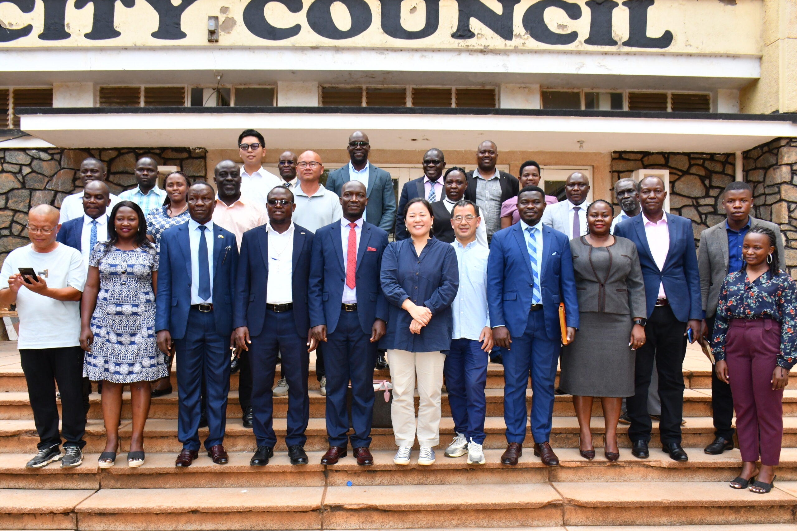 Director General Mula Anthony, Mayor Jinja City Kasolo Peter, Goodwill Ambassador Si-Chuan -Uganda Cooperation Shu Xiao Li in Group photo with Jinja City leaders on Wednesday at Jina City Hall( Credit : Donald KIriya)