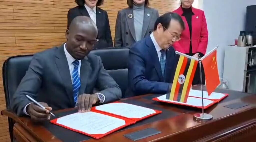 Dr. Mula signing the agreement on behalf of Jinja School of Nursing and Midwifery along with Prof. Wu Yudong President of Shenyang Medical College.