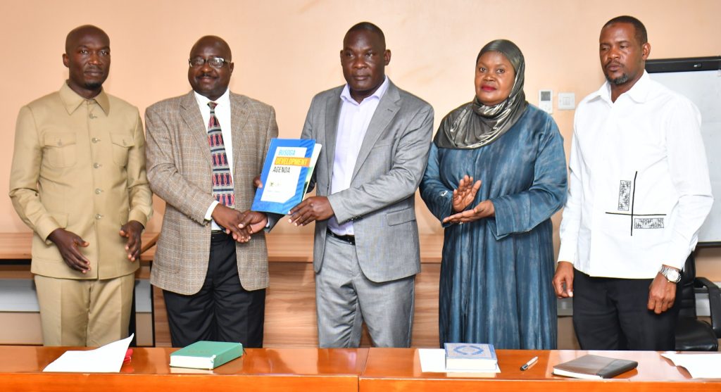 Official handover of BCD leadership from Bishop Frank Tibagendeka to Mulumba Davidson Kasajja, witnessed by Rt. Hon. Rukia Nakadama and the Director General Mula Anthony at Civil Service College, Jinja.